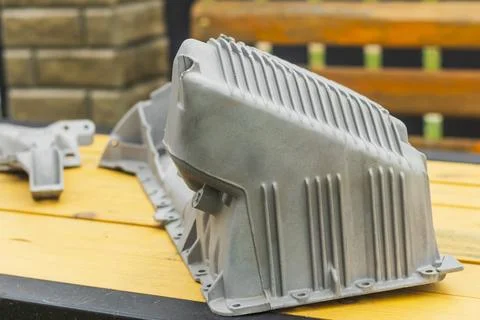 The metal engine component showcases intricate design features, capturing the Foto stock