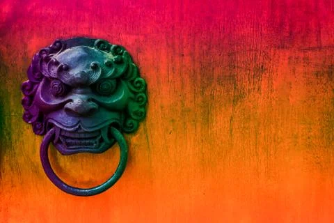 Metal evil face pull gate and hard wood surface background 库存照片