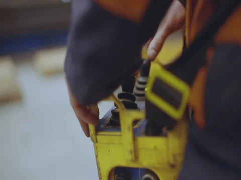 Metal factory operator operating remote, close up Stock Footage 75406477