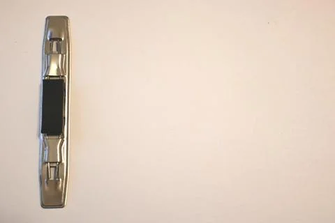 Metal fastening hardware on a plain background Stock-Fotos