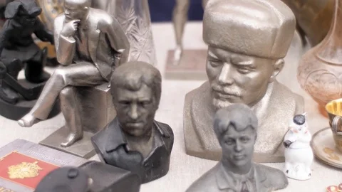 Metal figurines stand on the table Stock Footage 104029977