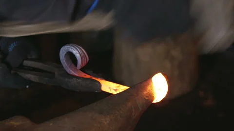 Metal forging, Forging hot metal in smithy, Sparks, hard work Stock Footage 68635683