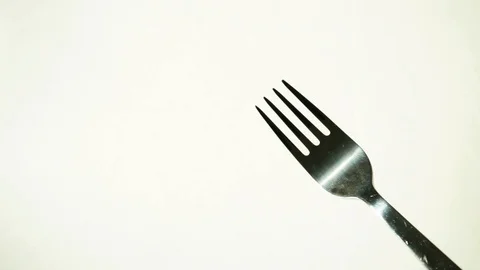 Metal fork on white background. 1 Stock Footage 97876076