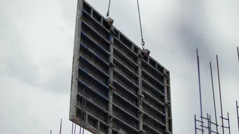 Metal formwork lifted by crane at construction site Stock Footage 327748298