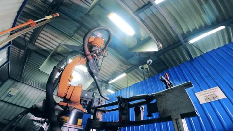 Metal frame is getting mechanically welded in a factory unit Vídeo Stock 146638418