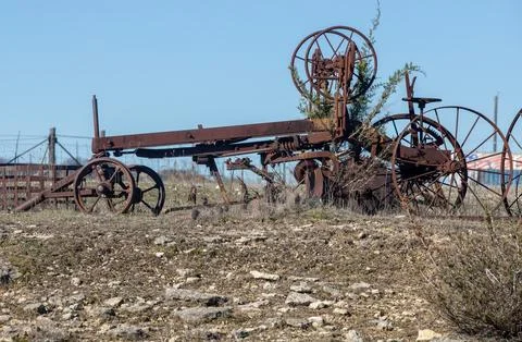 Metal frame of an old rusting tractor Stock Photos