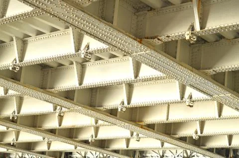 Metal frame under a bridge with some parts in focus Stock Photos
