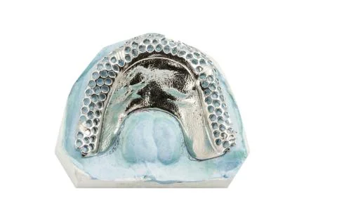 Metal frame work  for partial denture on a white background Stock-Fotos