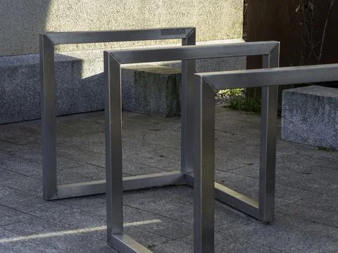 Metal frames stand on stone pavement Stock-Fotos