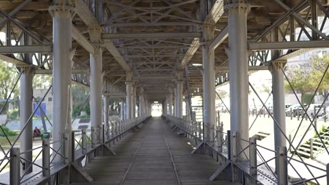 Metal framework with abandoned railtracks and wooden walkway on top Video stock 277207247