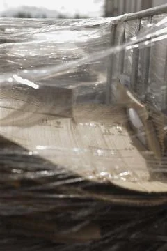 Metal framework with layered sheets illuminated by gentle morning glow Stock Photos