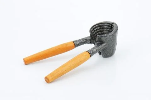 Metal funnel-shaped walnut cracker with wooden handles Stock Photos