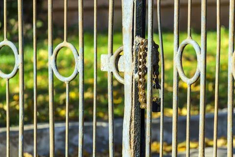 Metal gate locked using a motorcycle chain Stock Photos