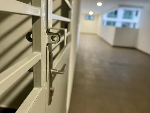 Metal gate opening to corridor Stock Photos