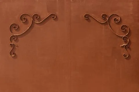 Metal gates with a pattern in the form of curls covered  paint. Stock Photos