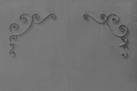 Metal gates with a pattern in the form of curls covered  paint. Stock Photos