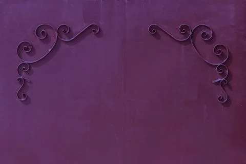 Metal gates with a pattern in the form of curls covered  paint. Stock Photos