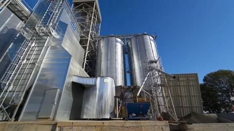 Metal grain elevator in agricultural zone Stock Footage 155680859