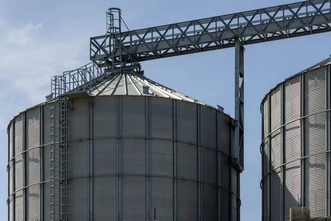 Metal grain silos with elevator loading constructions Stock Photos