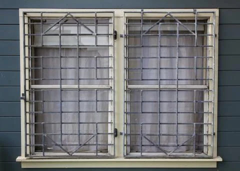 Metal grated windows Stock Photos