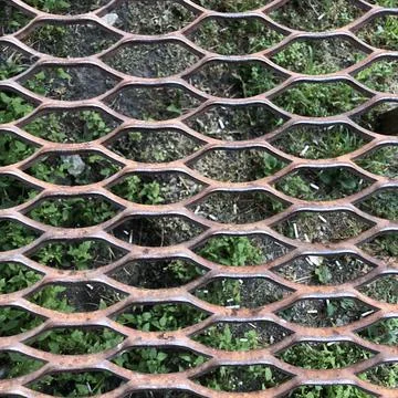 Metal grating the background of the earth Stockfoto's