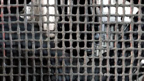 Metal grid background with blurred background Stock Photos