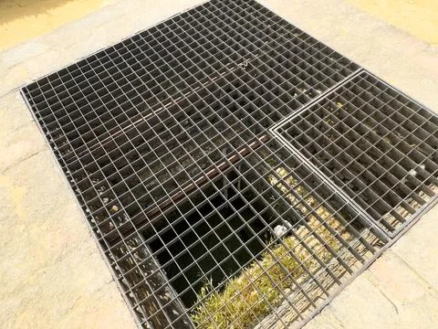 Metal grid background underground hatch Stock Photos