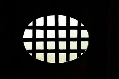 Metal grid from darkness Stock Photos