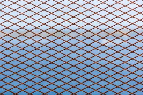 Metal grid as decorative or protective fence Stock Photos