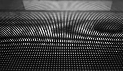 Metal grid with dramatic bokeh background Stock Photos