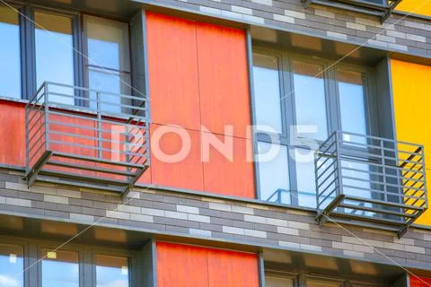 Metal grill casing protecting an external air conditioning compressor on the Stock Photos