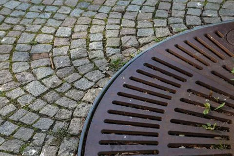 A metal grill with a circular radiating pattern Stock Photos