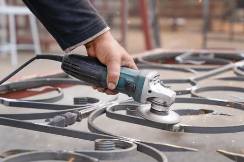 Metal grinding with angle grinder. Stock Photos