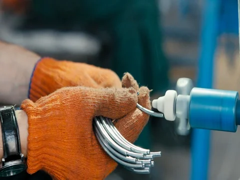 Metal grinding on bench grinder with flying sparks Stock Footage 77952989