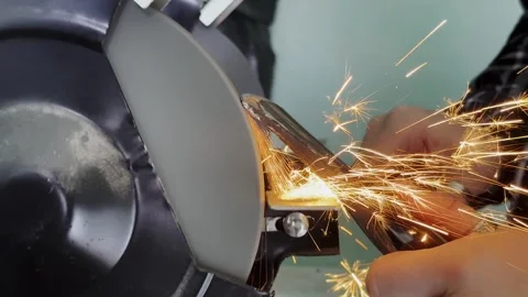 Metal Grinding Process with Sparks in Workshop Setting Stock Footage 336800670