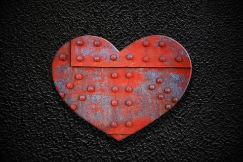 Metal heart on a dark texture Stock-Illustration