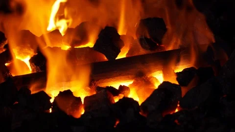 The metal is heated to red in the fire. Stock Footage 106619230