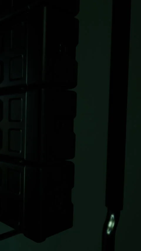 Metal hook and storage boxes on a dark wall in a warehouse area Stock Footage 337997976