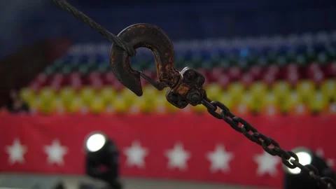 A metal hook with a large chain for securing safety ropes and circus equipment. Stock Footage 310655397