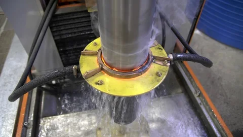 Metal induction hardening machine. Process of quenching metal with a high Stock Footage 128978396