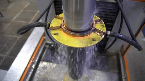 Metal induction hardening machine. Process of quenching metal with a high Stock Footage 128978665