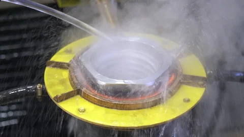 Metal induction hardening machine. Process of quenching metal with a high Stock Footage 128981581