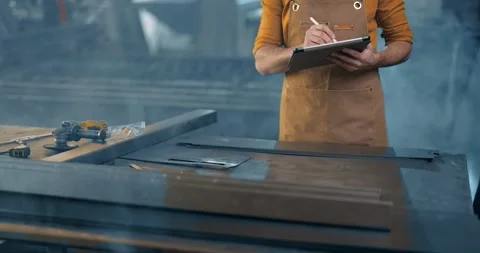 Metal industry worker with a digital tablet at the plant Stock Footage 147285290