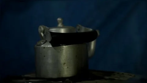 Metal Kettle on Dark Background with Dramatic Lighting Vidéo 327429876