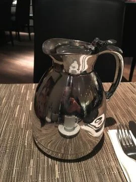 A metal kettle with a fork Stock Photos