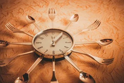 Metal kitchen clock. Stock Photos
