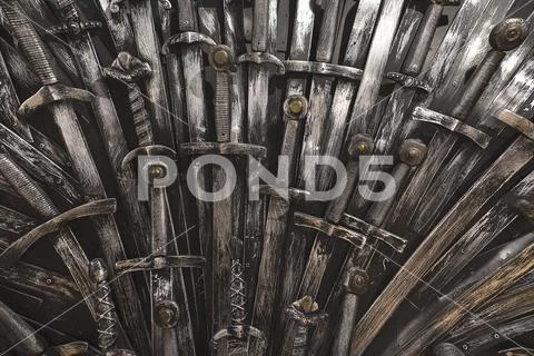 Metal knight swords background. Close up. The concept Knights. Stock Photos