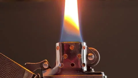Metal Lighter Ignites Producing Rhythmic Puffy Sound Stock Footage 329015389
