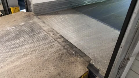 Metal loading dock plate joining truck detail Stock Footage 331252542