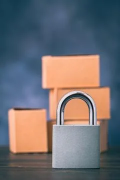 Metal lock in front of boxes Stock Photos